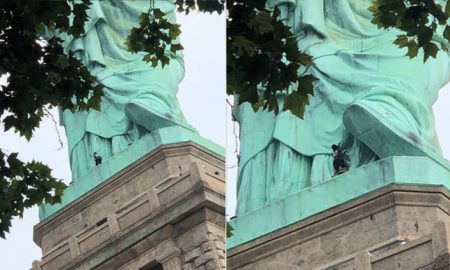 mujer escala estatua libertad